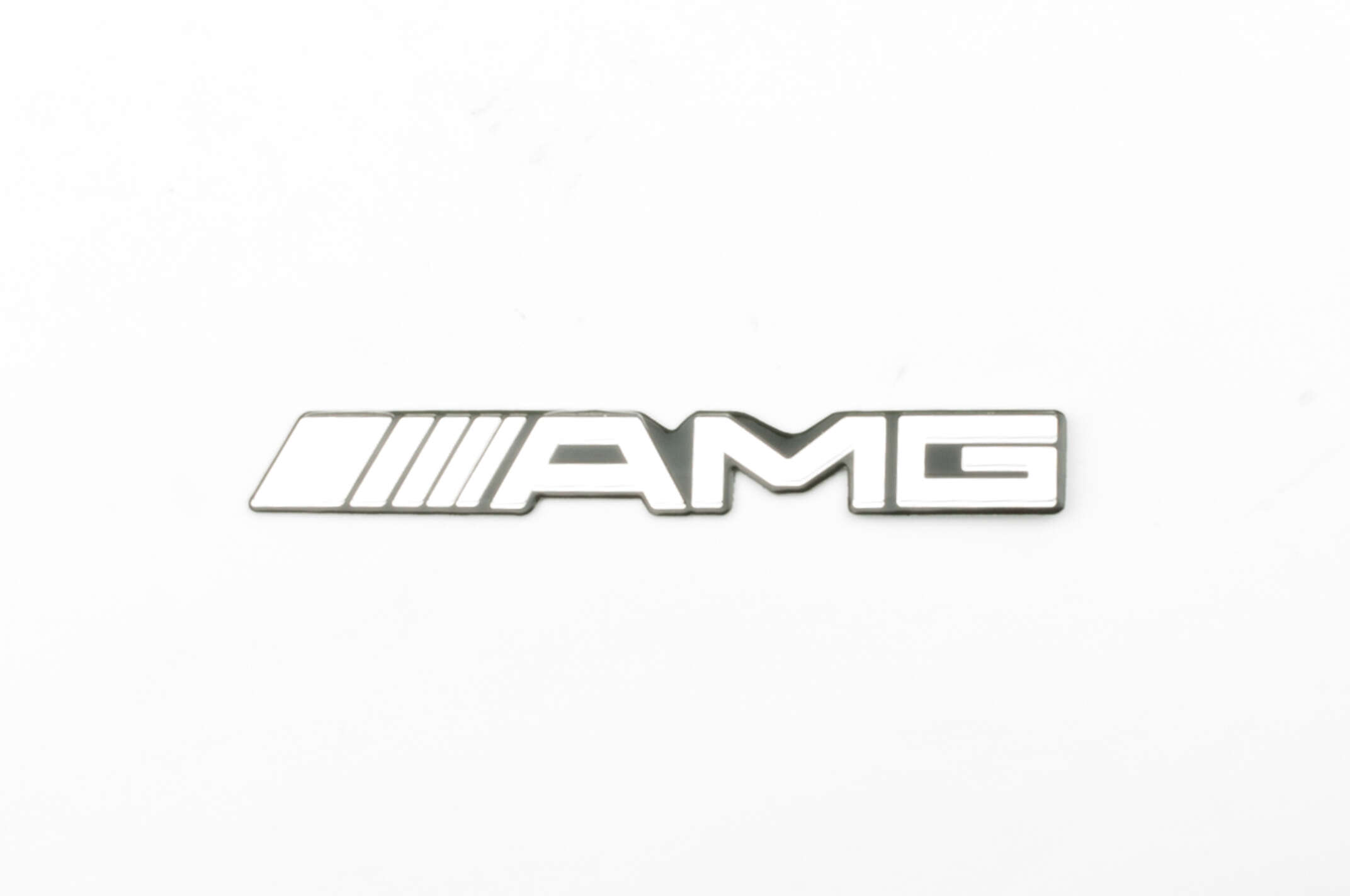 Наклейка шильдик AMG (14х2см, хром) (#4569)