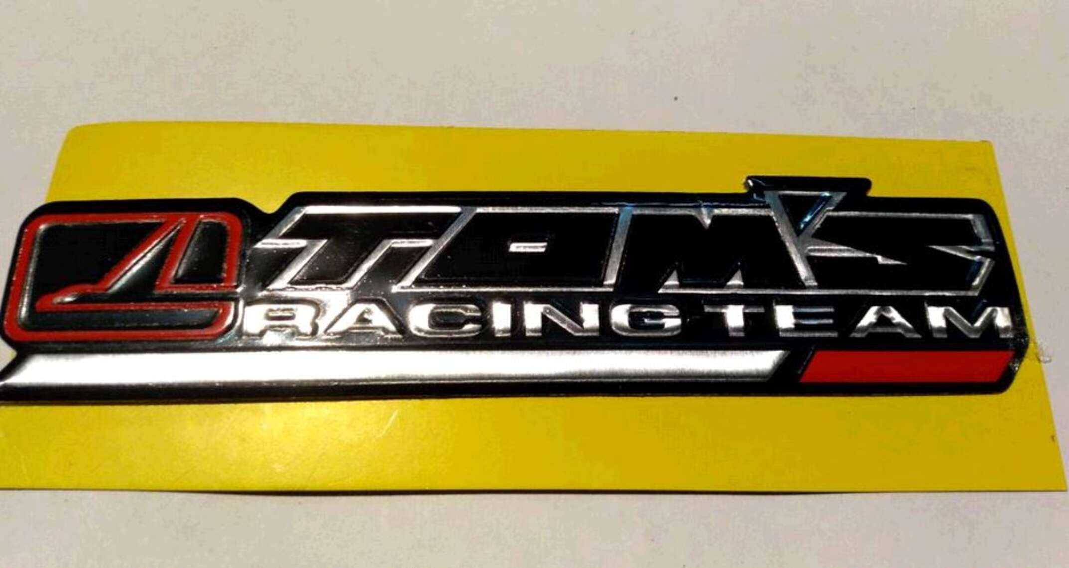 Наклейка шильдик TOMS RACING (14x4см)